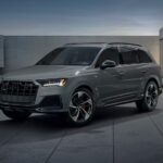 One of the most famous Audi SUVs, a gray 2023 Audi SQ7, is shown parked at night.