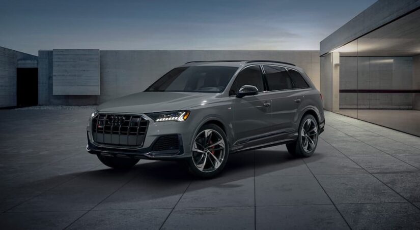 One of the most famous Audi SUVs, a gray 2023 Audi SQ7, is shown parked at night.