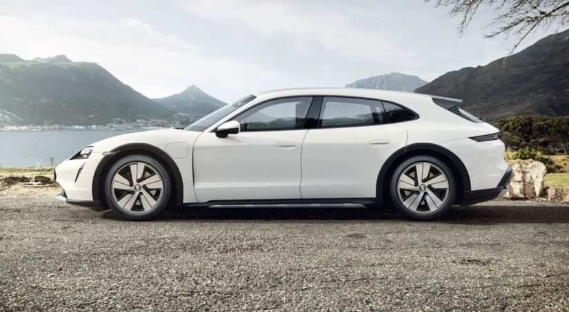 A white 2023 Porsche Taycan Cross Turismo is shown to be the best looking out of every station wagon you can buy in 2023.