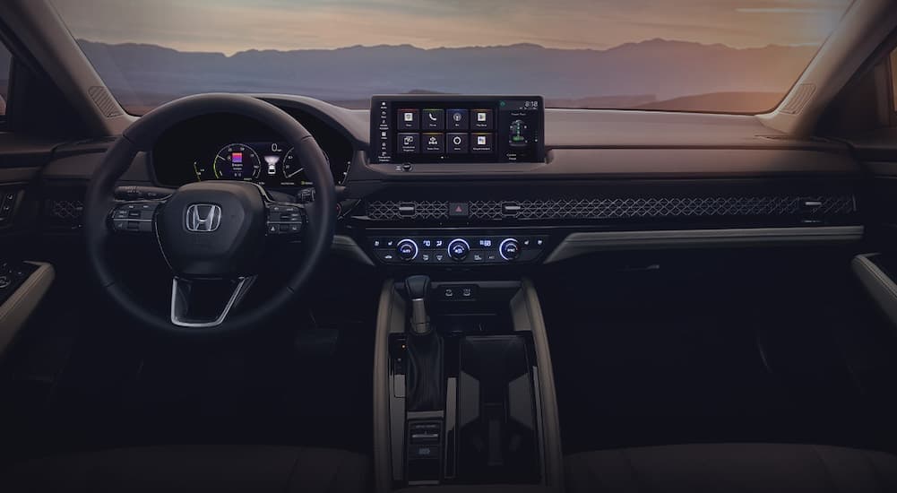 The black interior and dash of a 2023 Honda Accord is shown.