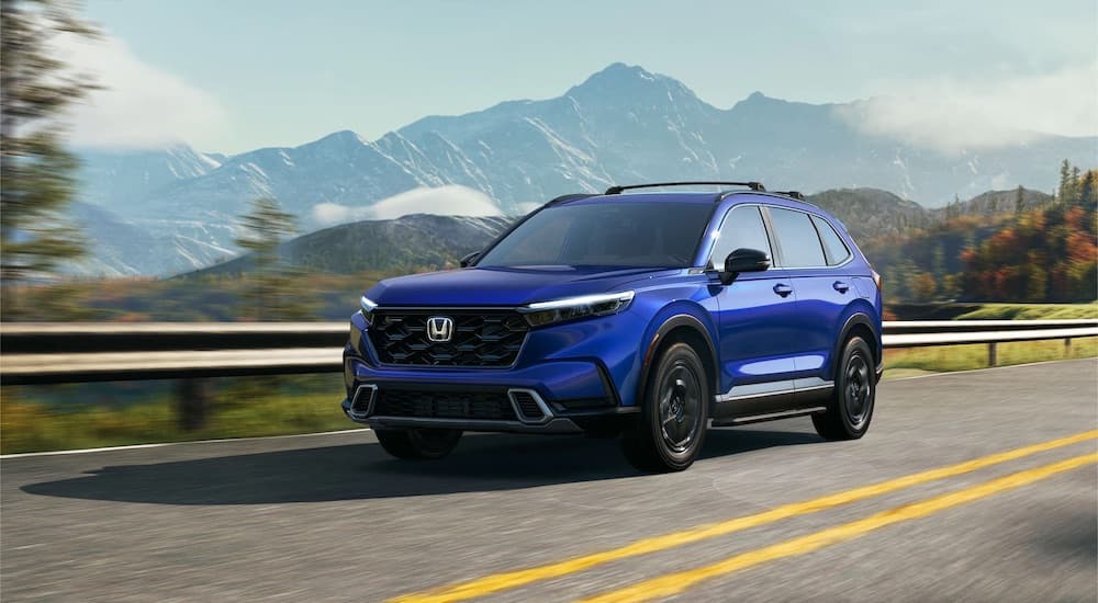 A blue 2023 Honda CR-V is shown rom the front at an angle.