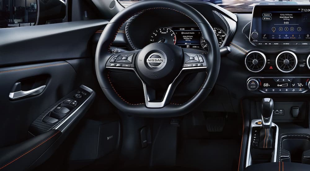The black dash of a 2023 Nissan Sentra is shown.