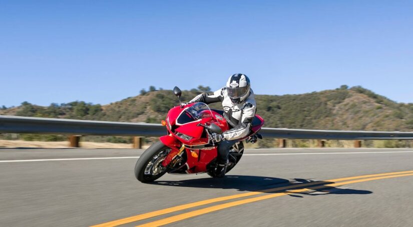A red 2023 Honda CBR600RR is shown from the front at an angle.