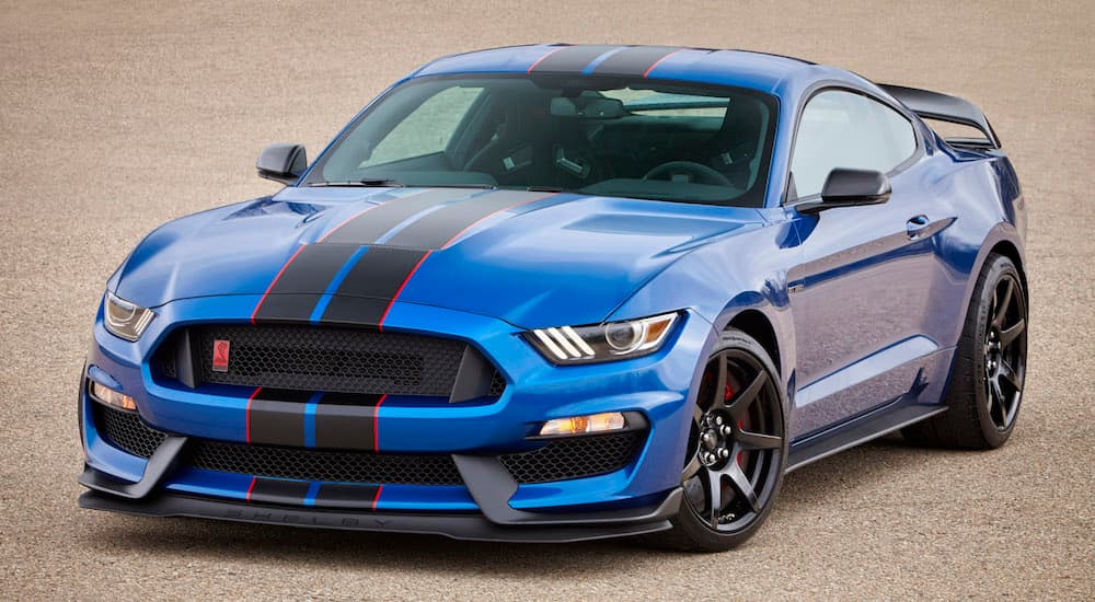 A blue 2017 Ford Mustang GT350R is shown from the front at an angle after leaving a used car dealership.