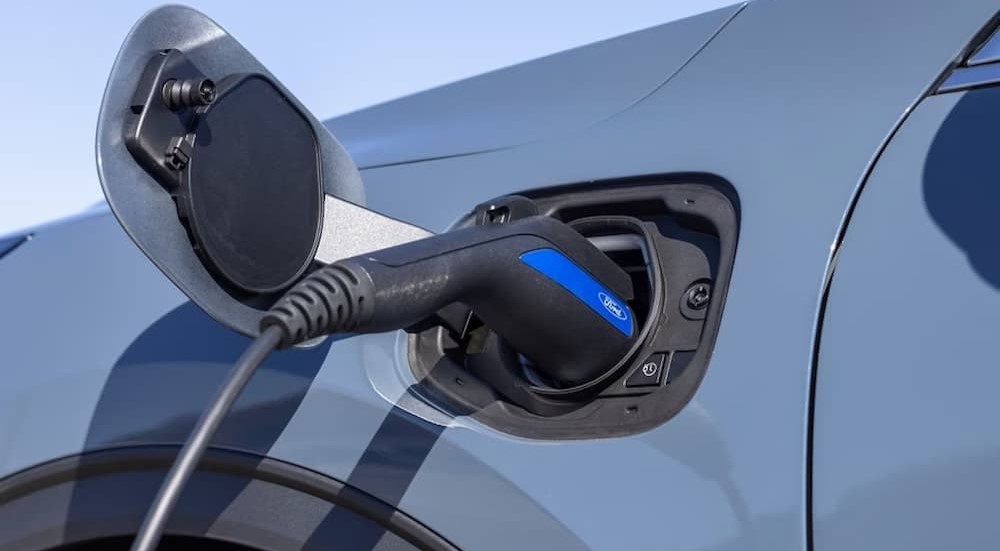 The charge port is shown on a blue 2023 Ford Escape Plug-In Hybrid.