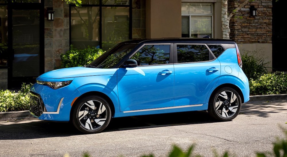 A blue 2023 Kia Soul is shown parked on a street.