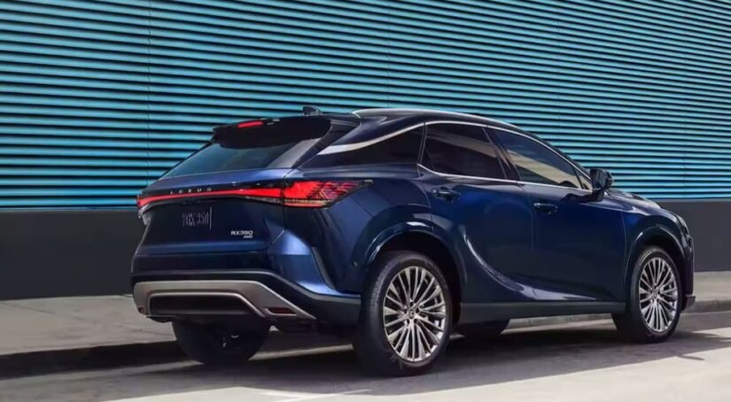 A blue Lexus RX350 is shown parked on a city road.