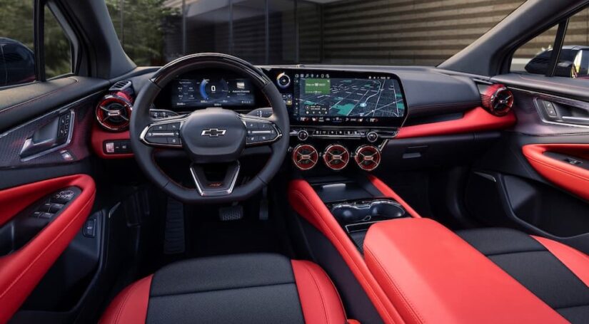 The red and black interior and dash of a 2024 Chevy Blazer EV is shown.