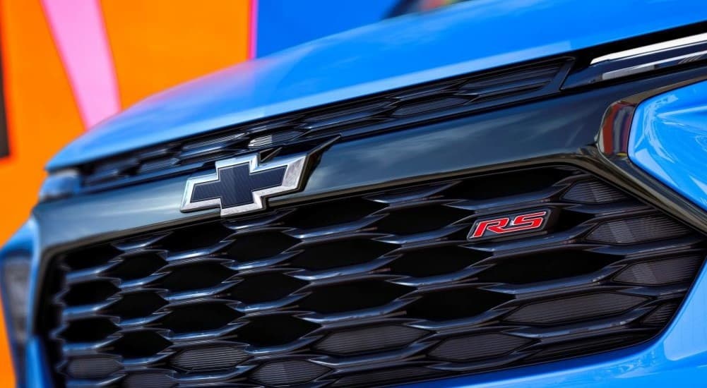 The black grille of a blue 2024 Chevy Trailblazer RS is shown.