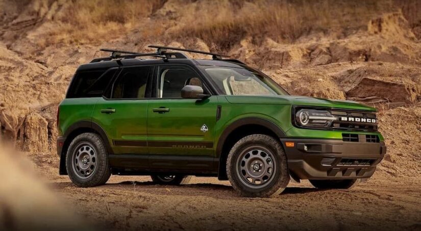 A green 2023 Ford Bronco Sport is shown parked off-road after competing in a 2023 Ford Bronco Sport vs 2023 Dodge Hornet competition.