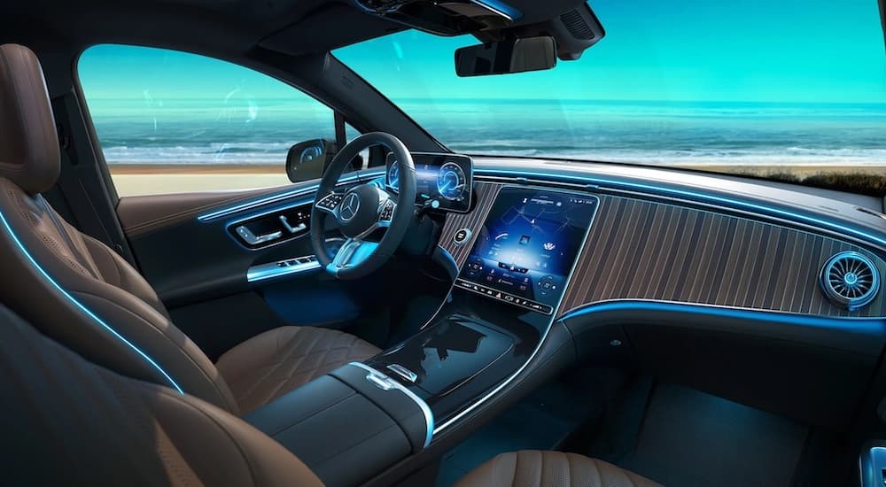 The brown interior and dash of a 2023 Mercedes-Benz EQE is shown.