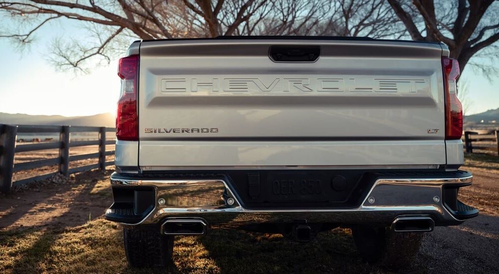 A close-up on the back of a white 2023 Chevy Silverado 1500 LT is shown.