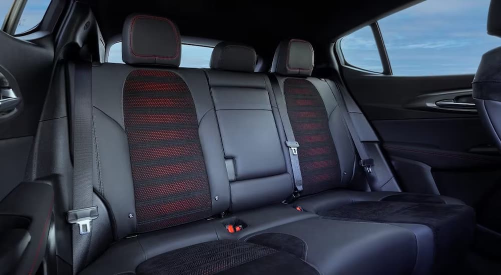 The black and red rear interior of a 2024 Dodge Hornet is shown.
