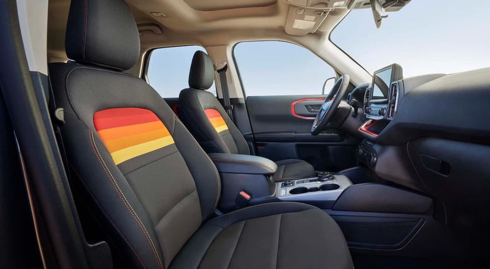 The black and orange interior of the 2024 Ford Bronco Sport Free Wheeling Edition is shown.