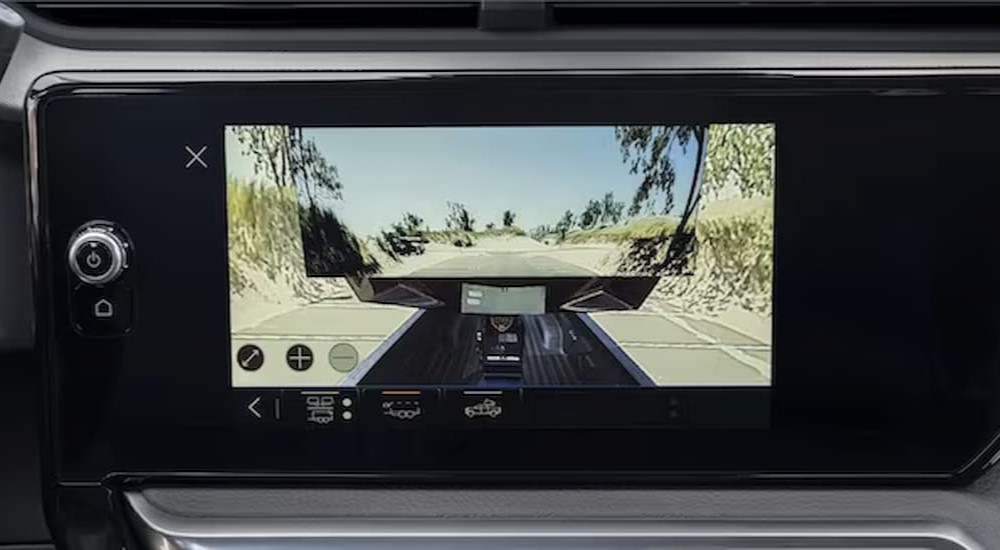 The camera system in a 2024 GMC Sierra 2500 Pro is shown on a black dash.