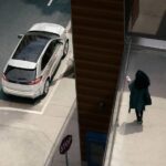 A white 2024 Ford Edge SE is shown parked on a curb as seen from above.