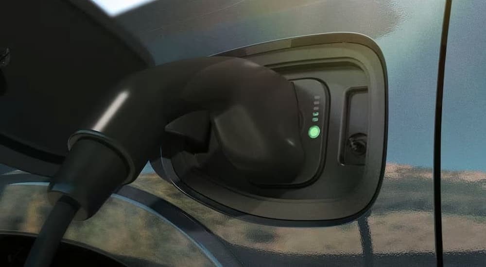 The smart charging port is shown on a 2025 Ram 1500 Ramcharger.