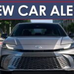 A New Car Alert banner is shown above a silver 2025 Toyota Camry.