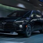 A black 2024 Chevy Blazer Midnight Edition is shown driving in a tunnel.
