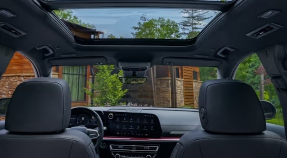 The gray interior and dash of a 2024 Chevy Traverse is shown.