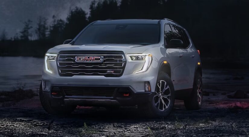 A silver 2024 GMC Acadia AT4 is shown parked off-road after visiting a GMC dealer near Lynchburg.