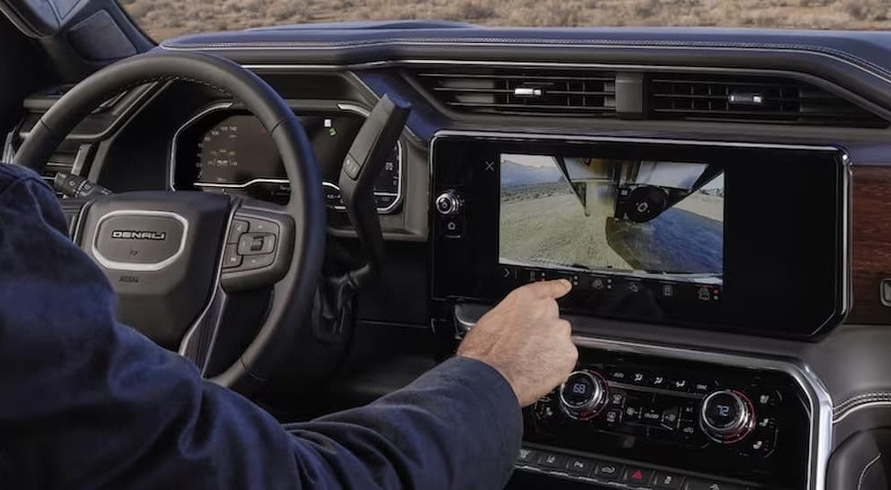 The infotainment screen and dash in a 2024 GMC Sierra HD 2500 is shown.
