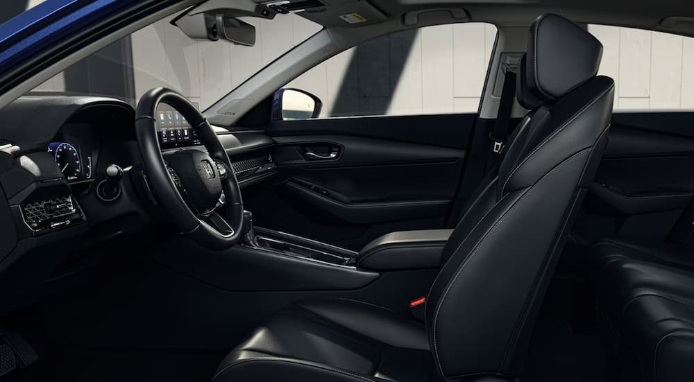 The black interior and dash of a 2024 Honda Accord is shown.