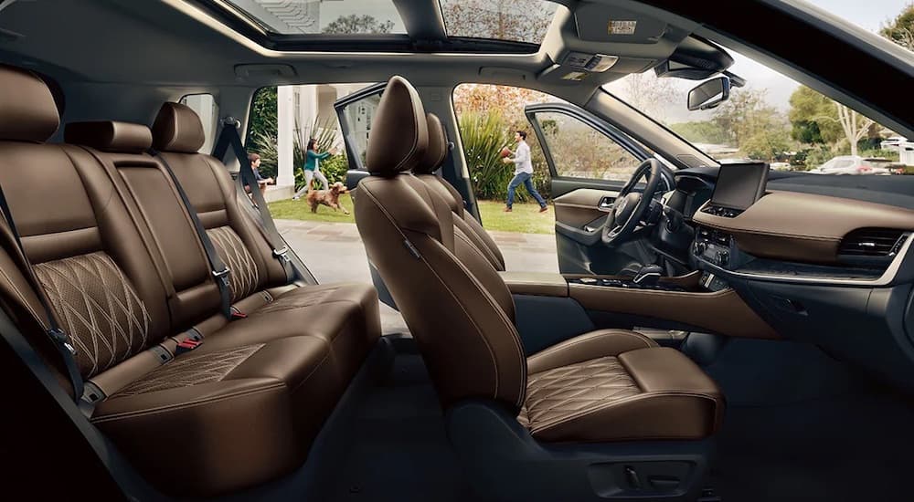 The brown interior of a 2024 Nissan Rogue is shown.
