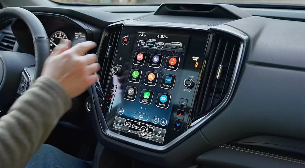 The black dash and infotainment screen in 2024 Subaru Ascent is shown.