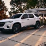 A popular Chevy Traverse for sale, a white 2023 Chevy Traverse, is shown parked on a driveway.