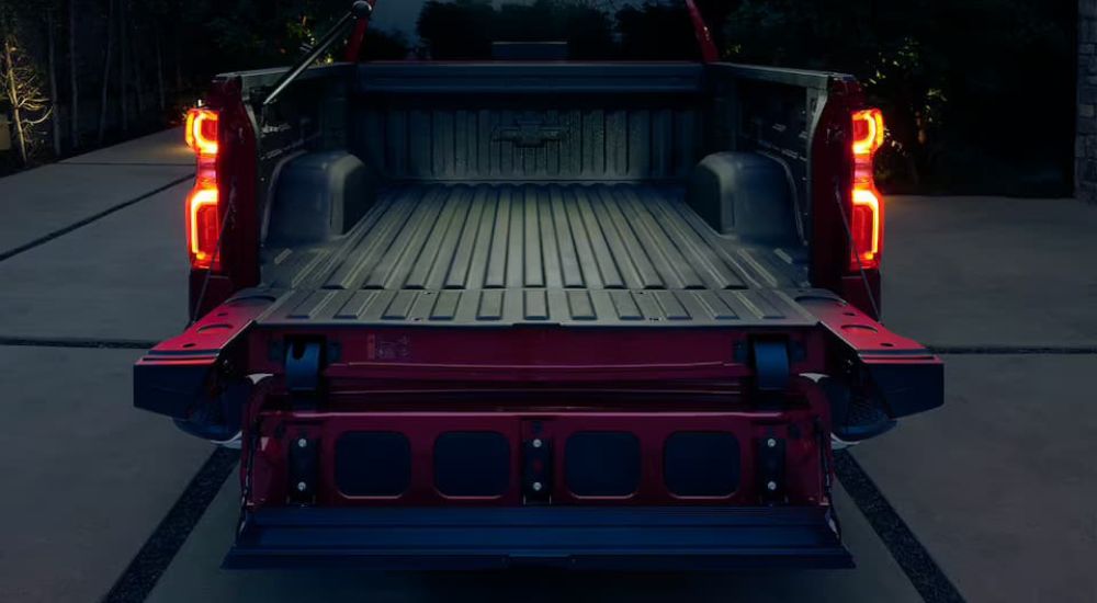 The multiflex tailgate on a red 2024 Chevy Silverado 1500 is shown.
