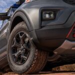 A close-up on the front wheel of a 2024 Ford Explorer Timberline is shown.