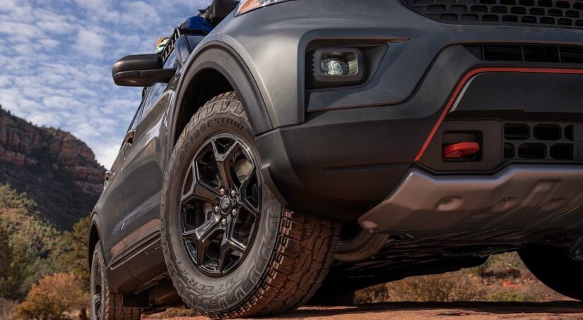 A close-up on the front wheel of a 2024 Ford Explorer Timberline is shown.