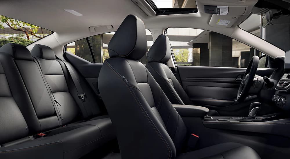 The black interior of a 2024 Nissan Altima with zero gravity front bucket seats.