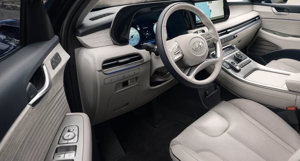 The white interior cabin and front seats of a 2025 Hyundai Palisade.