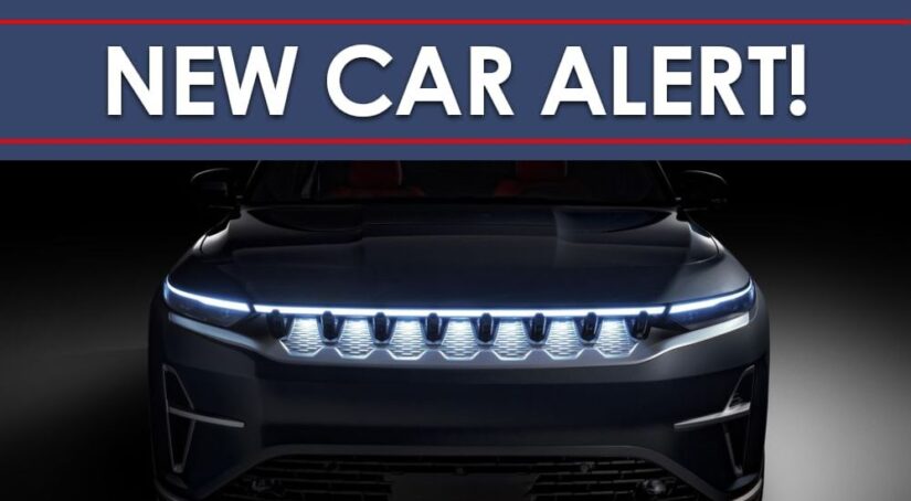 New Car Alert banner above a closeup of the grille and headlights of a 2025 Jeep Wagoneer S EV glowing the dark.
