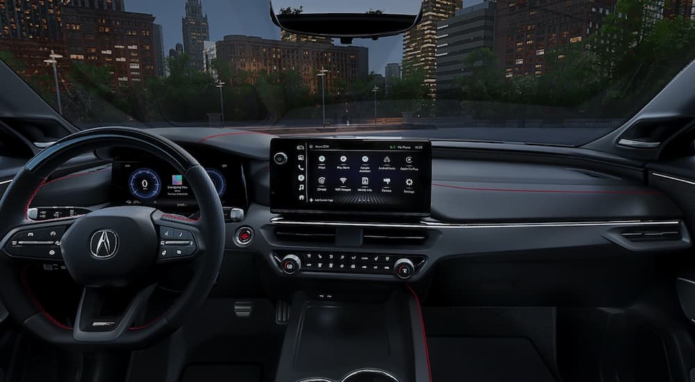The black interior of a 2024 Acura ZDX at night. 