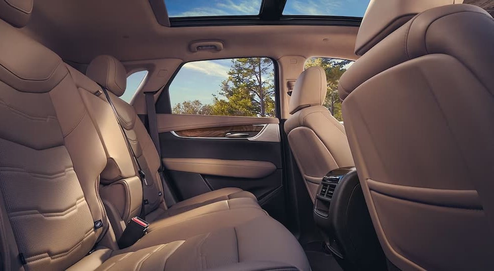 The tan interior in a 2024 Cadillac XT5 is shown.