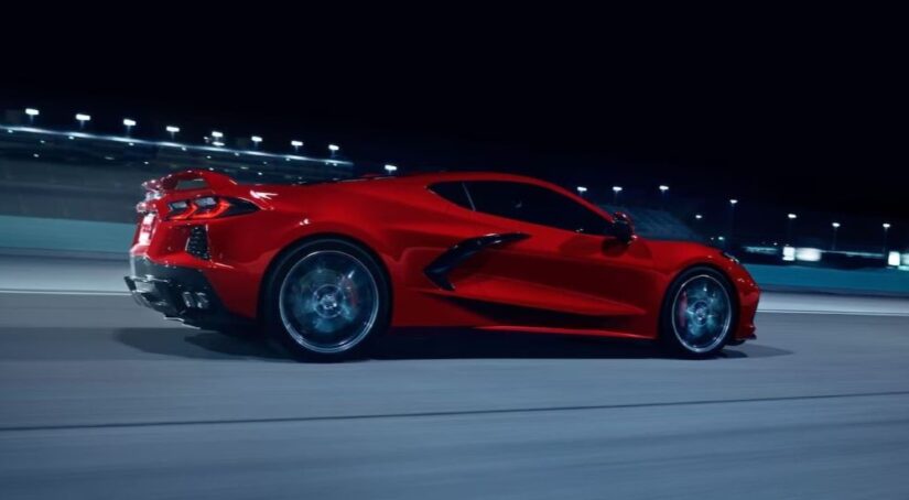 A red 2024 Chevy Corvette Stingray Z51 is shown driving on a track.