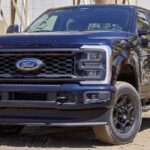 A black 2024 Ford F-250 is shown parked off-road.