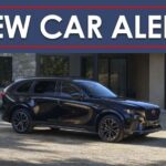 A black 2025 Mazda CX-70 is shown under a new car alert banner.