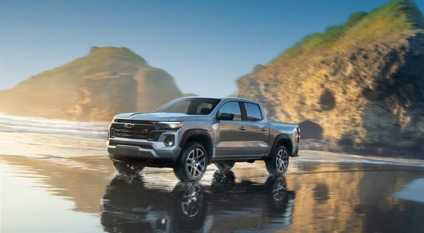 A silver 2024 Chevy Colorado Z71 is shown driving on water.