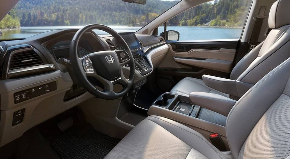 The gray interior and dash is shown in a 2024 Honda Odyssey.