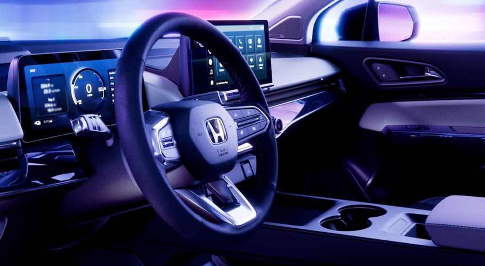 The black interior of a 2024 Honda Prologue is shown from a driver's seat.