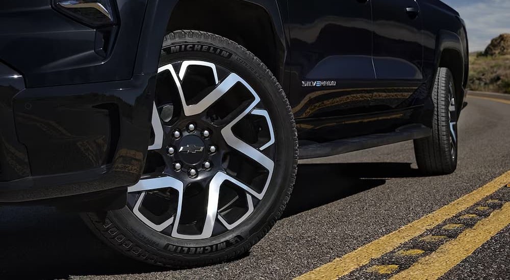 A close-up of the wheel on an upcoming Silverado PHEV is shown.
