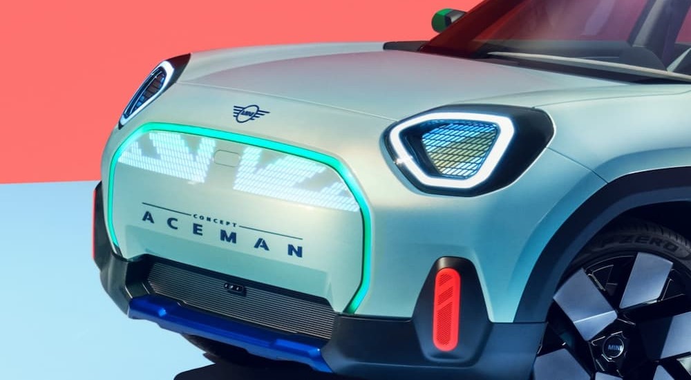 A close-up of a green 2025 MINI Aceman Concept is shown.