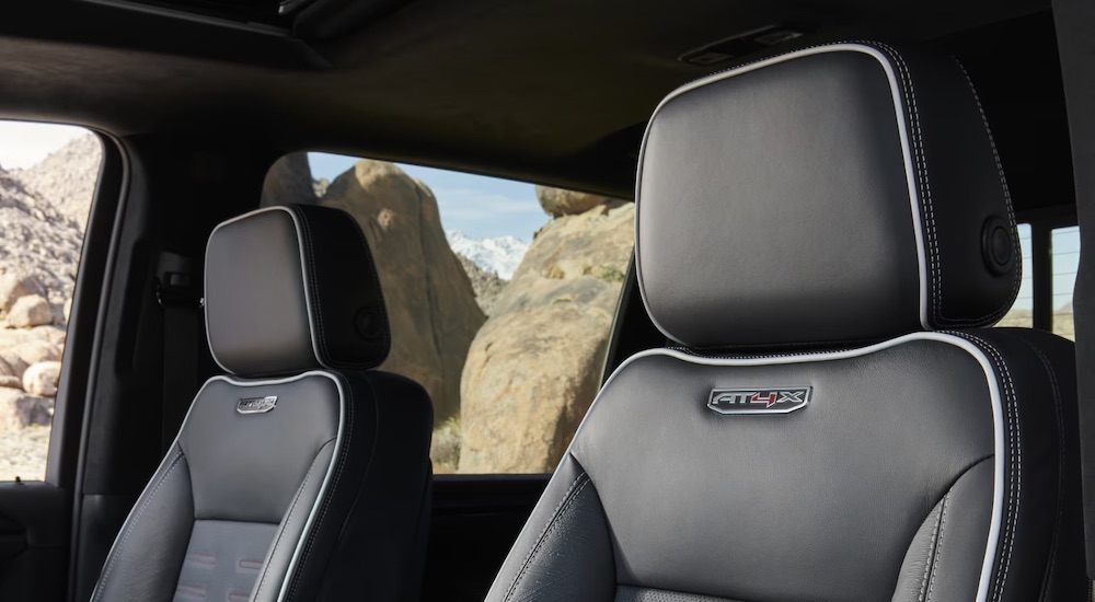 The black front seats of a 2024 GMC Sierra 2500 HD AT4X.