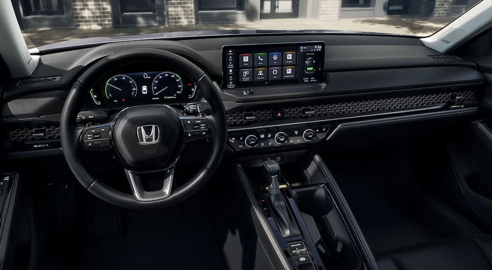 The steering wheel and dashboard in a 2024 Honda Accord.