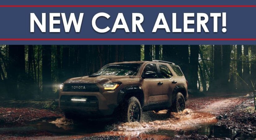 A brown 2025 Toyota 4Runner driving through muddy water in the woods under a New Car Alert banner.