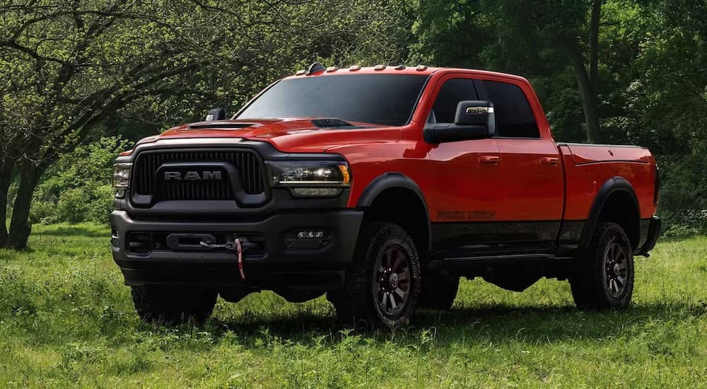 A red 2024 Ram 2500 Power Wagon is shown from the front at an angle.